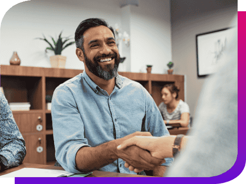 casual business man smiling and shaking hands