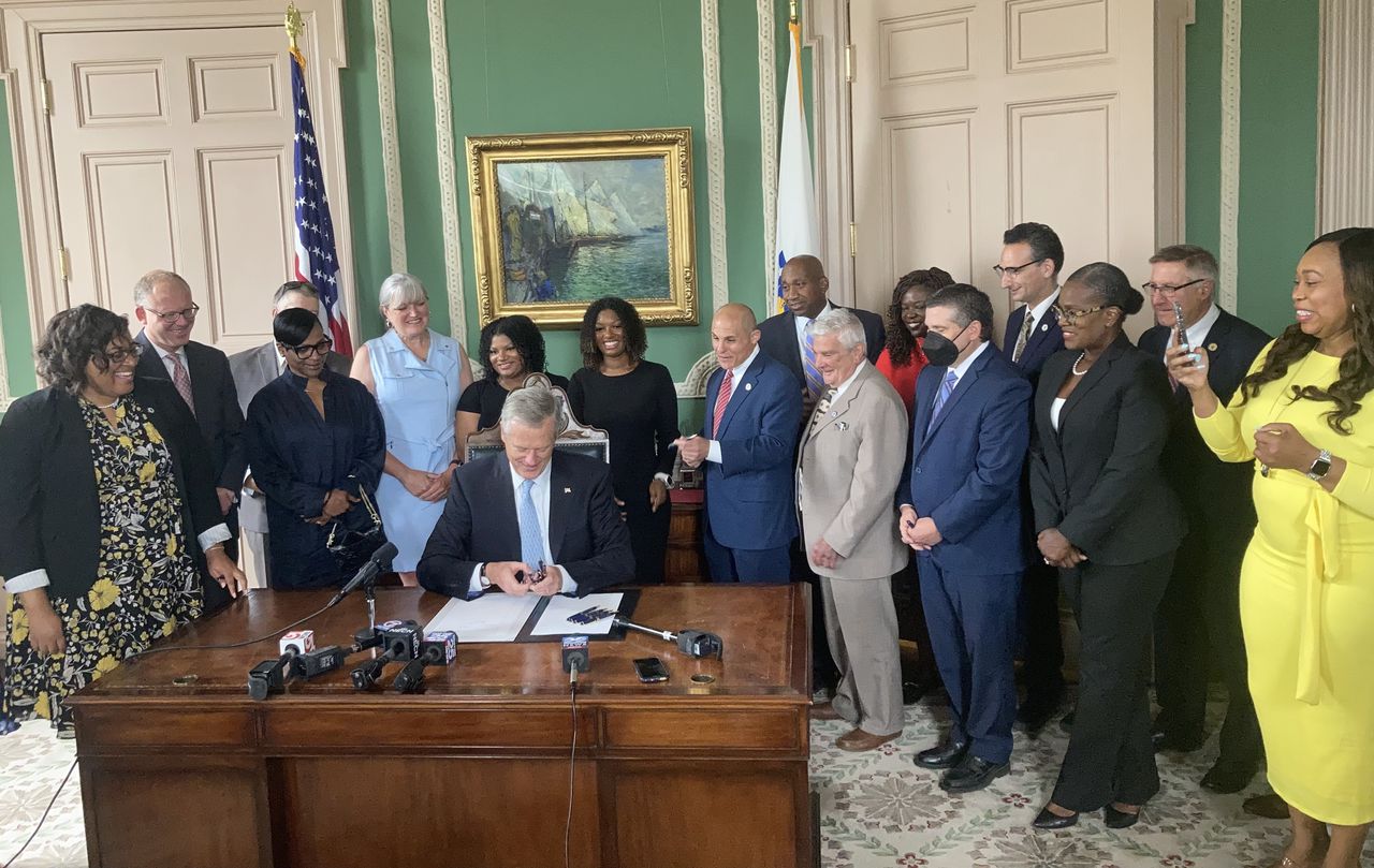 Gov. Charlie Baker signing into law the Creating a Respectful and Open World for Natural Hair (CROWN) Act 