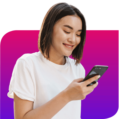 a woman smiling using a mobile phone