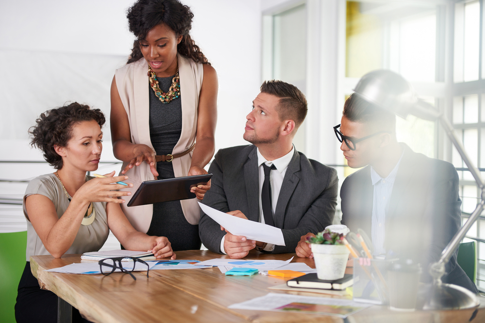 team of successful business people having a meeting in executive sunlit office-2